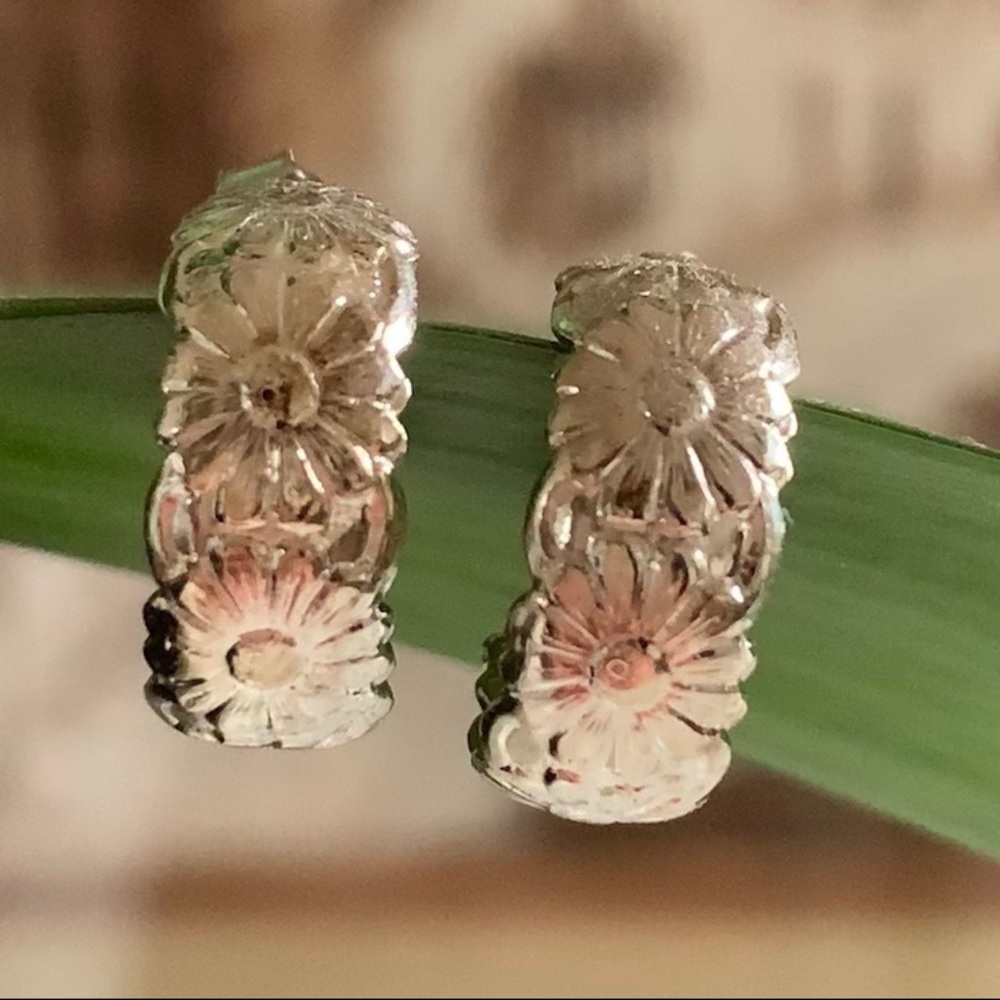 Silver toned floral hoop earrings
